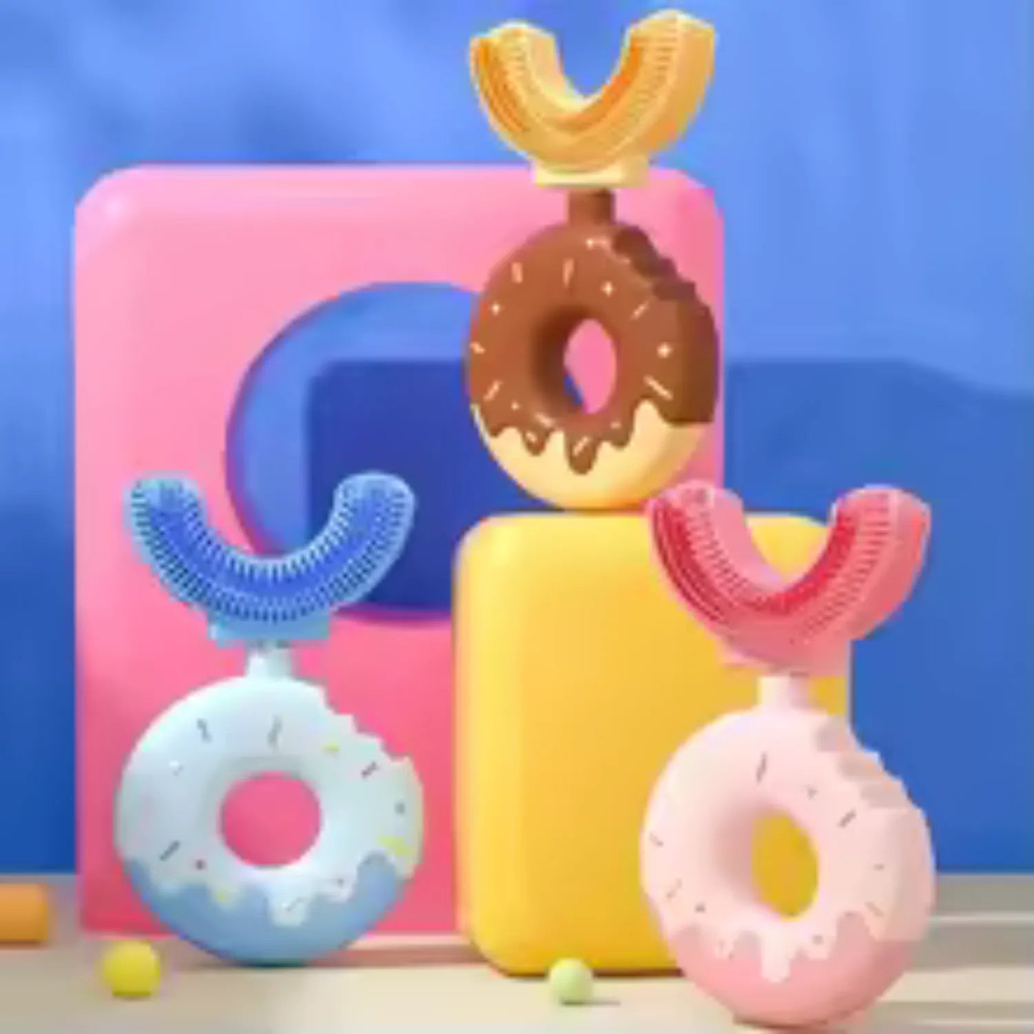 Front angle view of donut U-shape kids toothbrush showing soft silicone brush head and easy grip handle