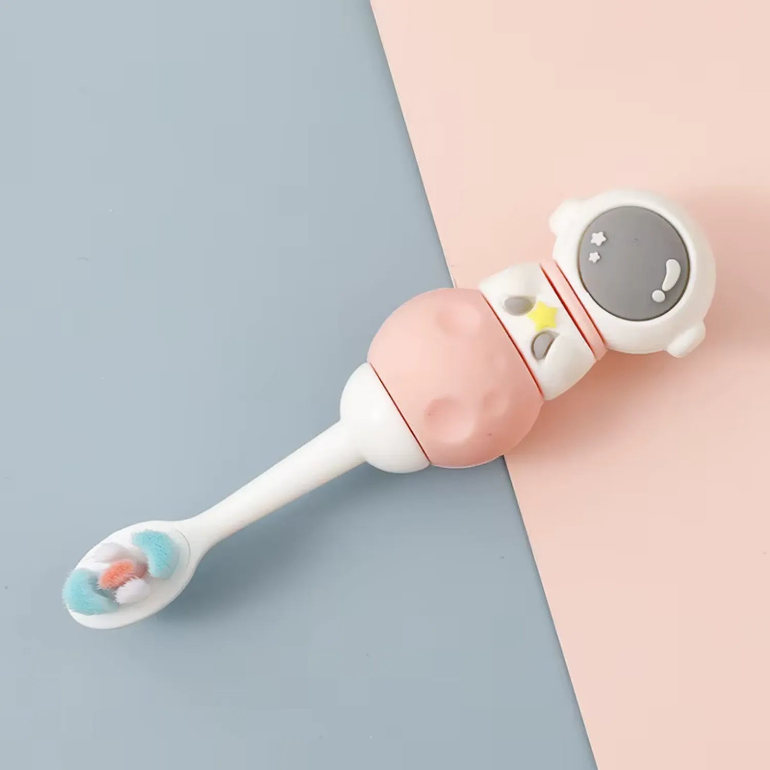 Pink astronaut kids toothbrush with fun space theme helping children enjoy brushing their teeth daily