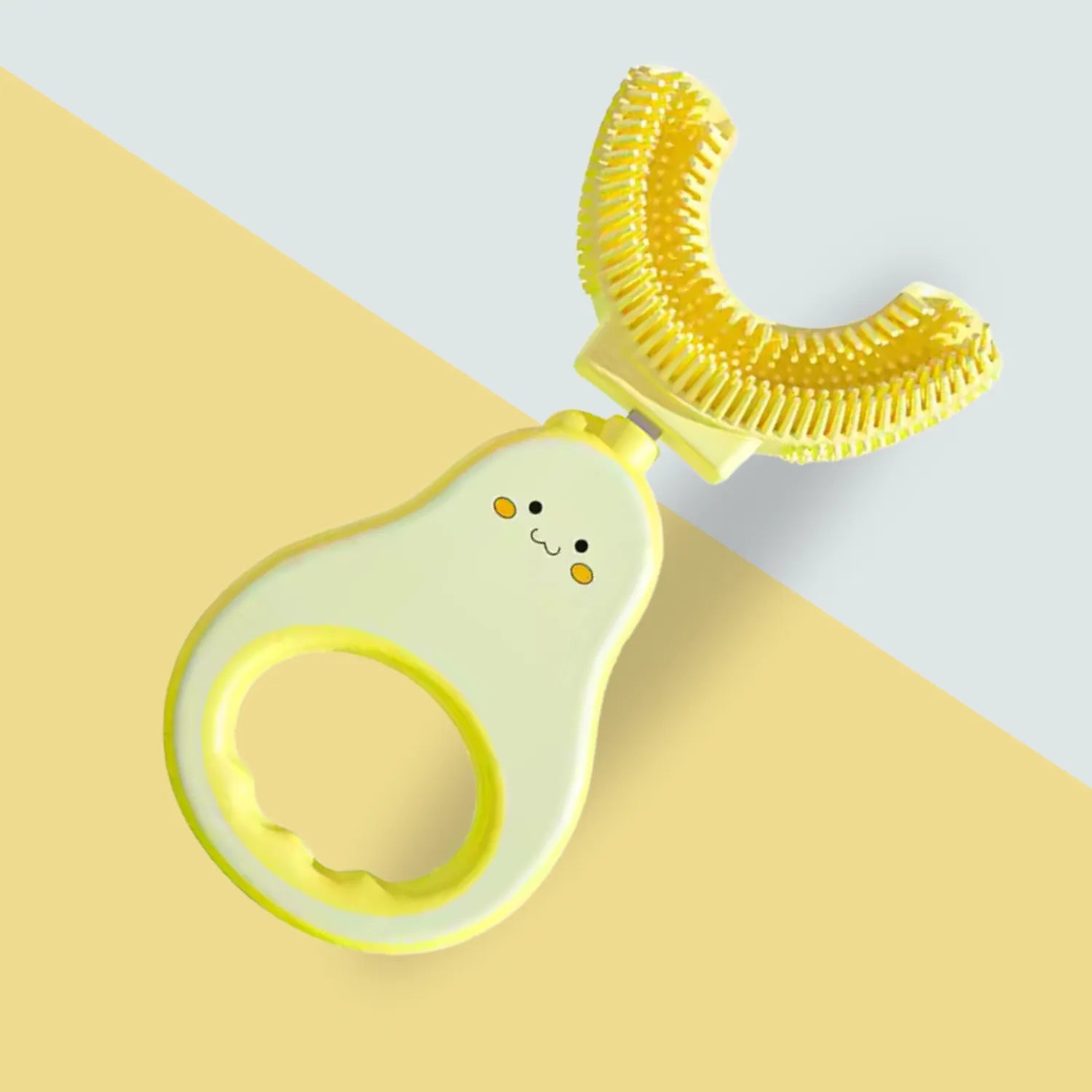 Front angle view of avocado U-shape kids toothbrush showing soft silicone brush head and easy grip handle
