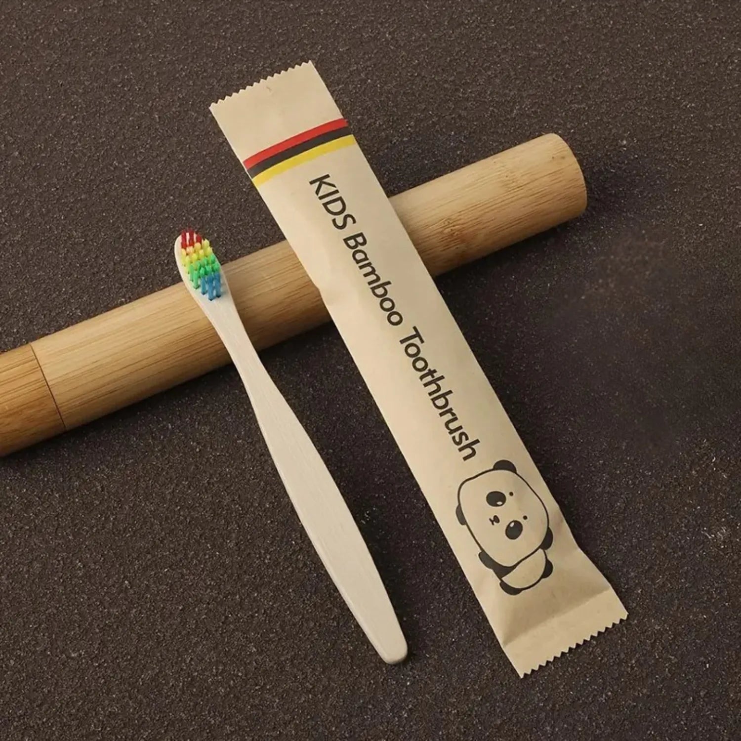 Front angle view of kids bamboo toothbrush showing soft bristles and smooth natural bamboo handle