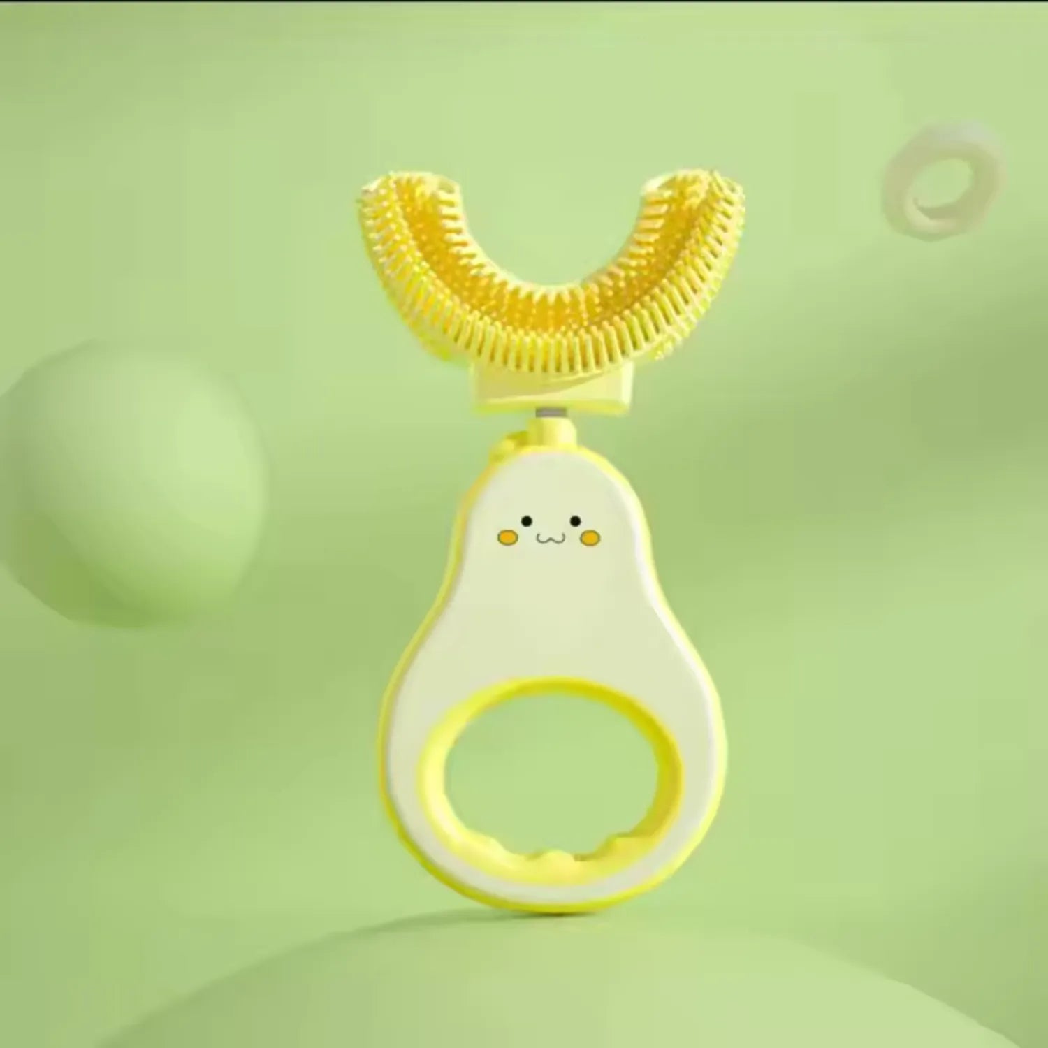 Front view of avocado U-shape kids toothbrush designed for ages 2 to 6 with gentle full mouth cleaning